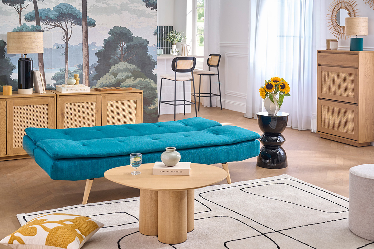 Canap� convertible scandinave 3 places bleu canard avec table basse dans un salon moderne.